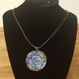 Recycled soda can pendant on leather rope